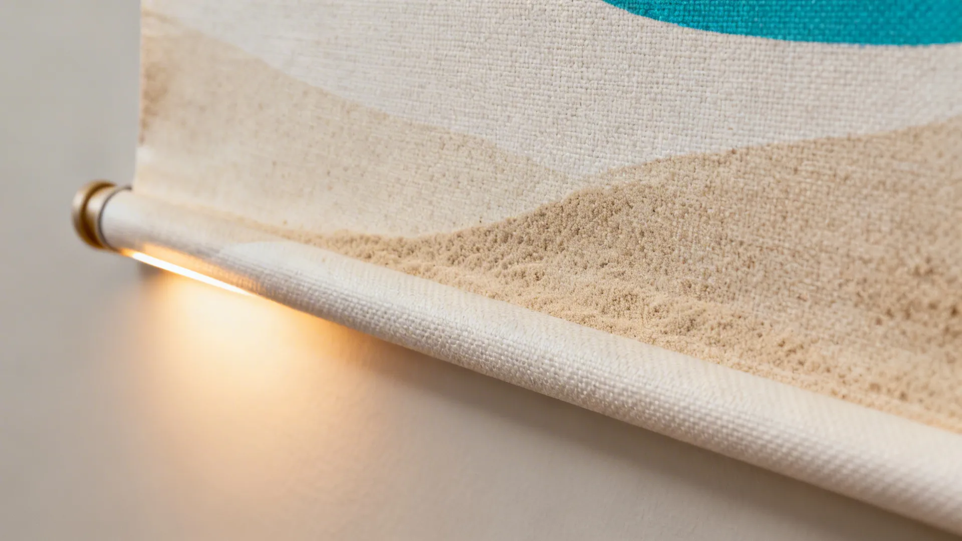 Macro of warm light casting a soft glow on a fabric banner and vinyl wall.