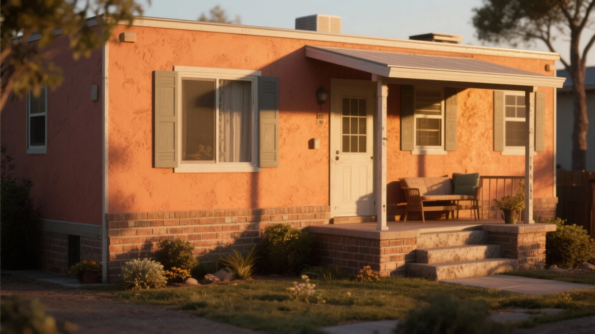 Small terracotta house with a front porch sofa and green plants under warm evening sunlight