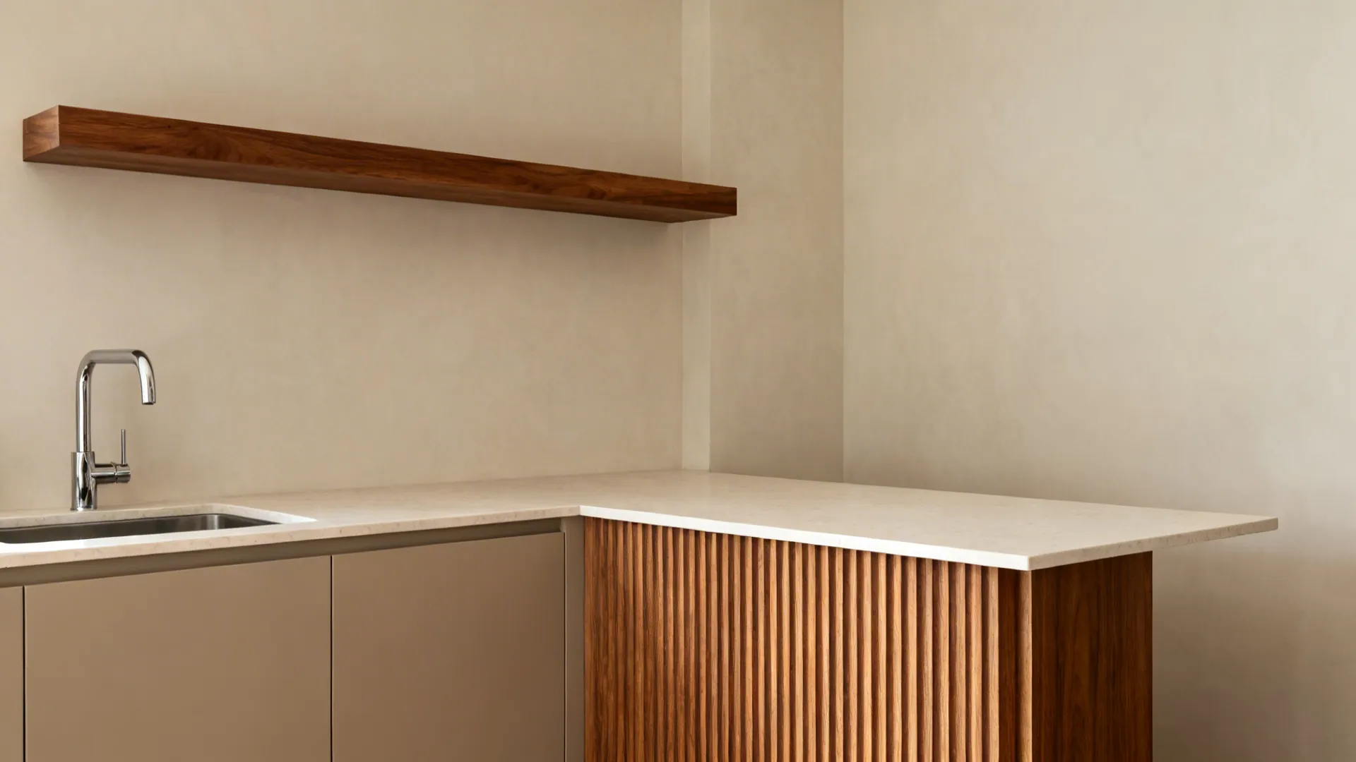 Compact kitchen with walnut shelf and a fluted oak panel balancing neutral cabinets.