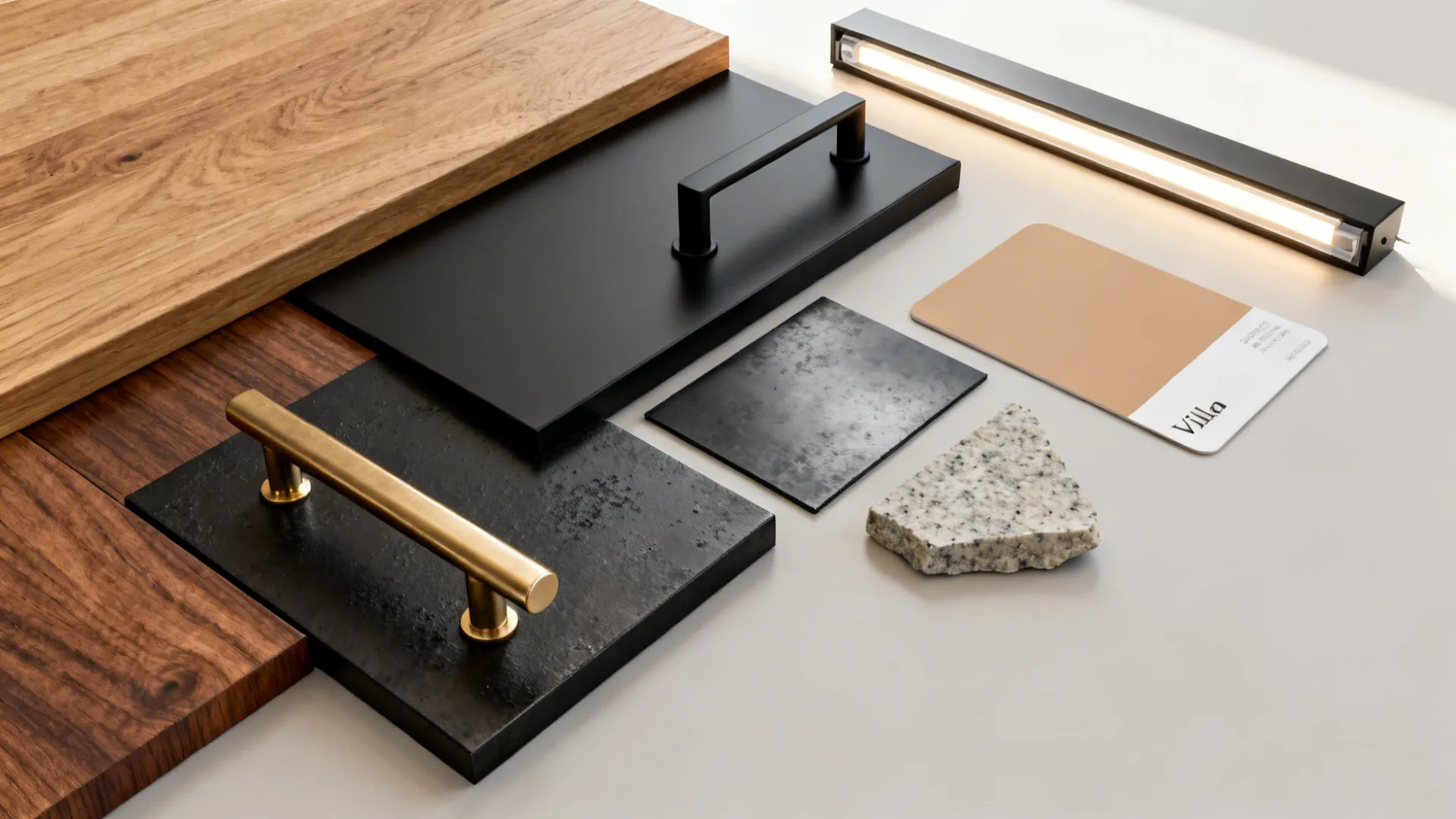 Flatlay of rift oak, walnut, brushed brass, matte black, and honed stone samples.