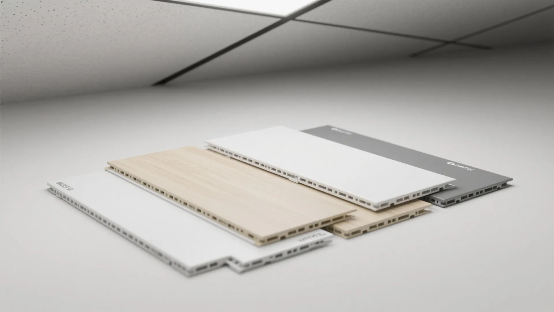 Samples of waterproof wall panels featuring white wood and grey finishes on a clean background