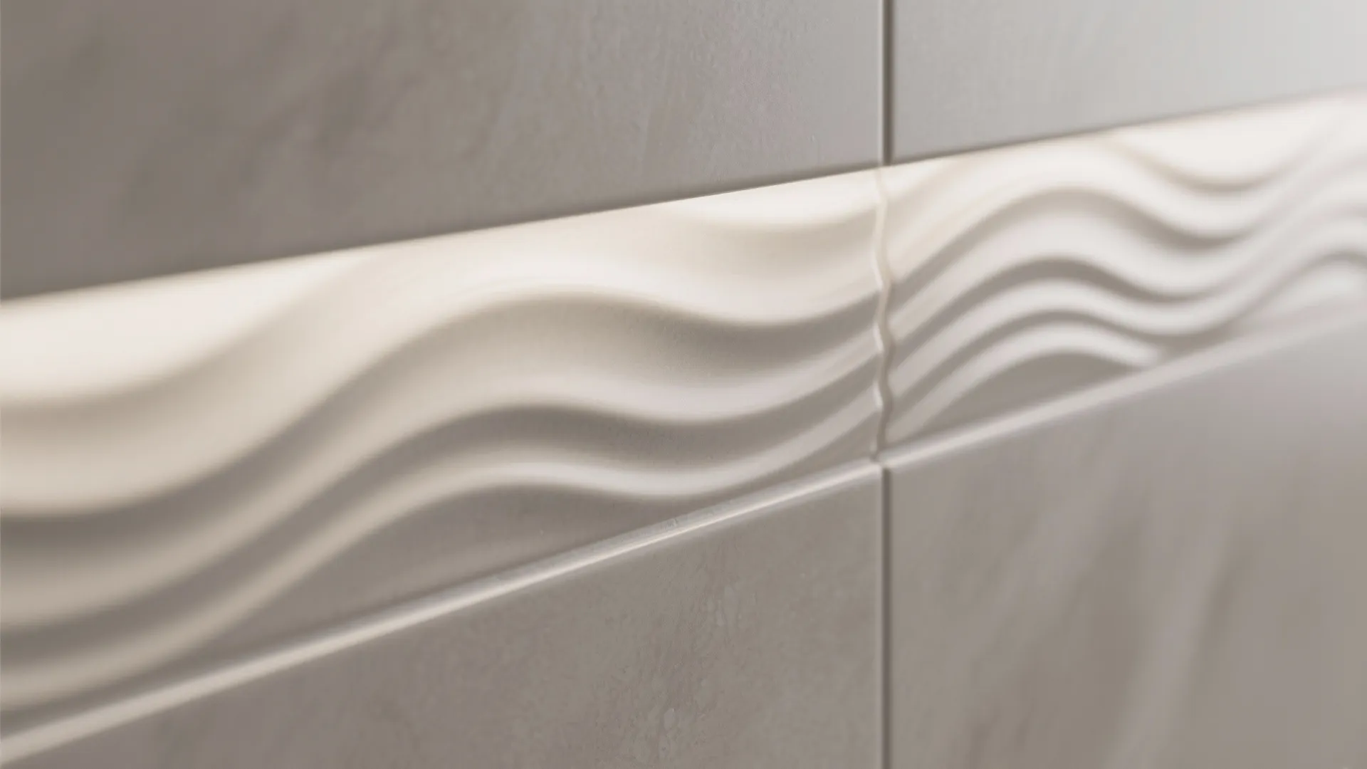 Close up of grey wall tiles with a white decorative wavy pattern for modern interior