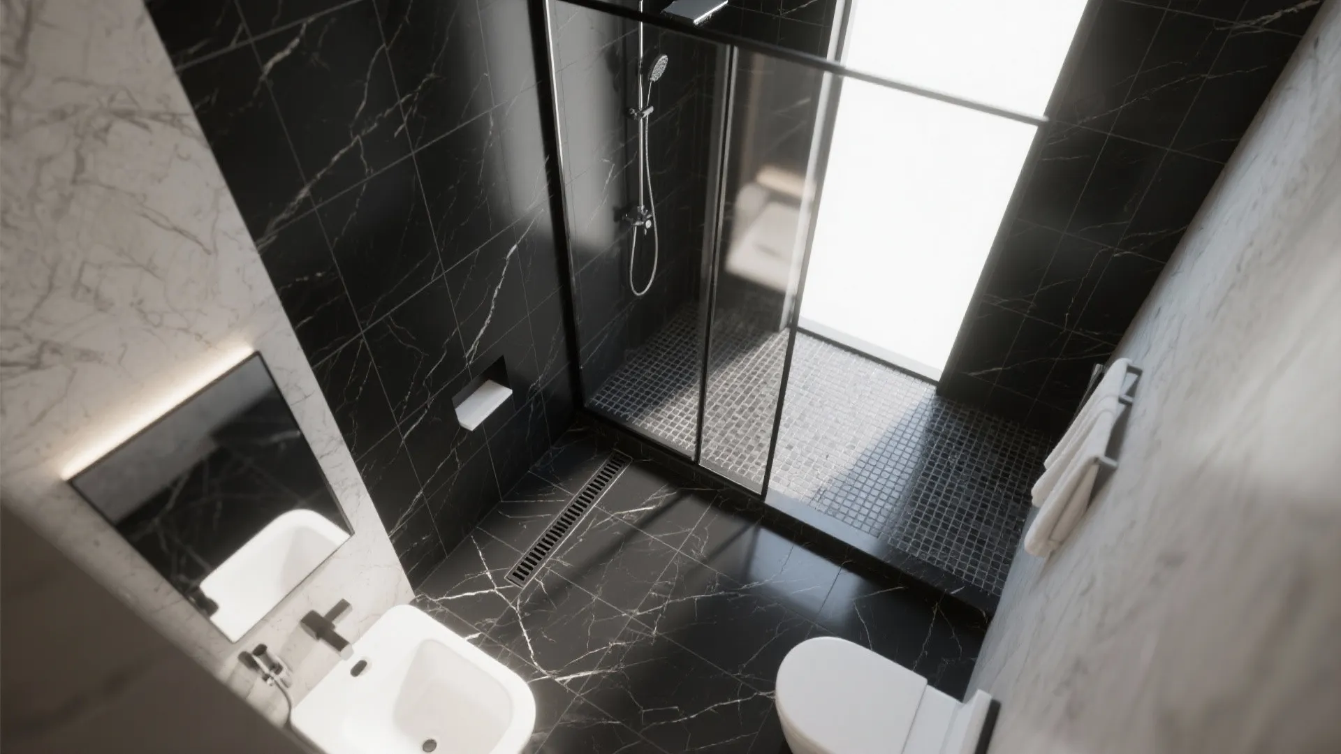 Top-down view of a seamless wet room with linear drain, continuous black marble tiles, and a curbless shower for a compact bathroom.