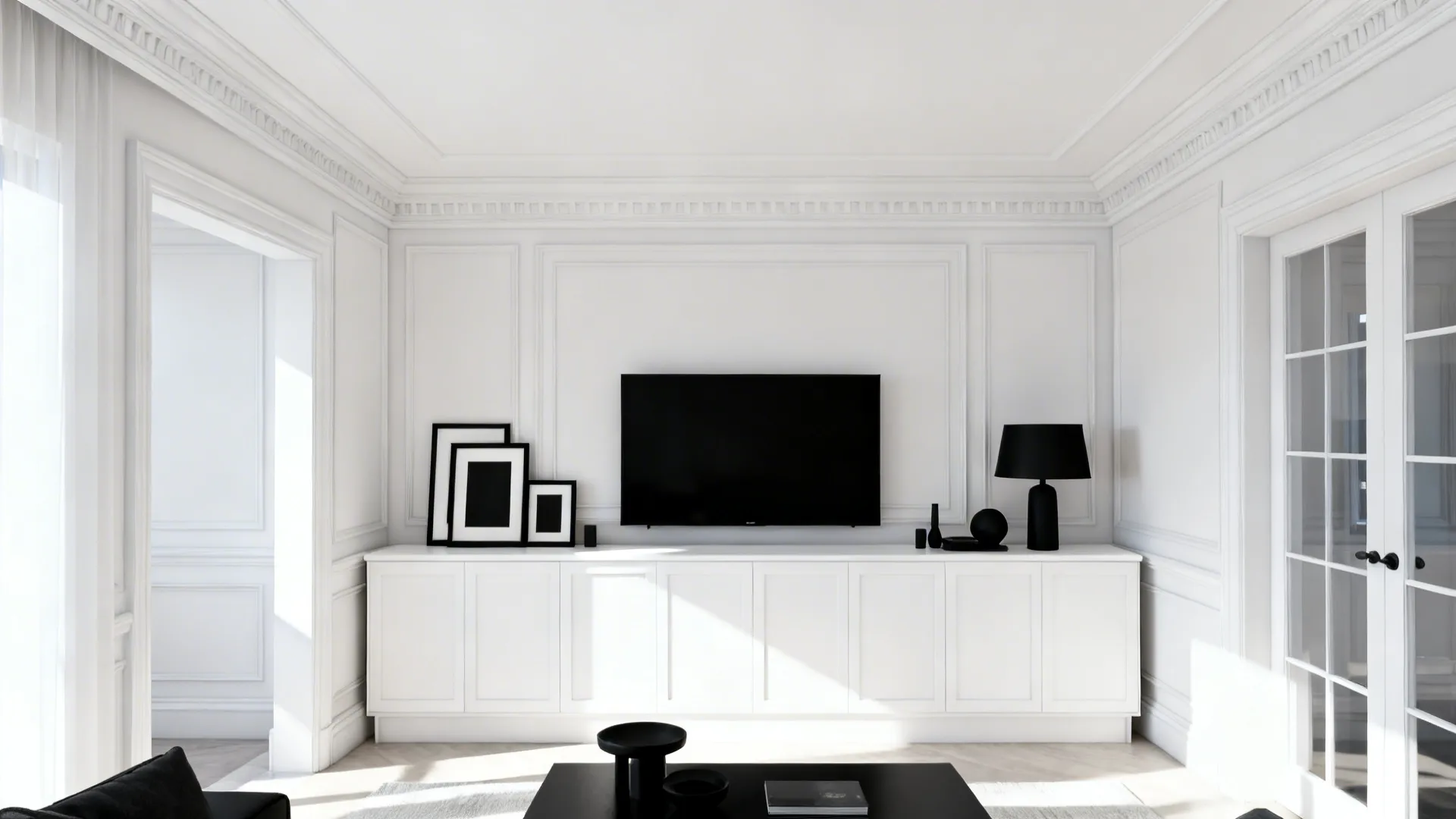 Small living room with white ceiling, mouldings and a white media console balancing black accessories.