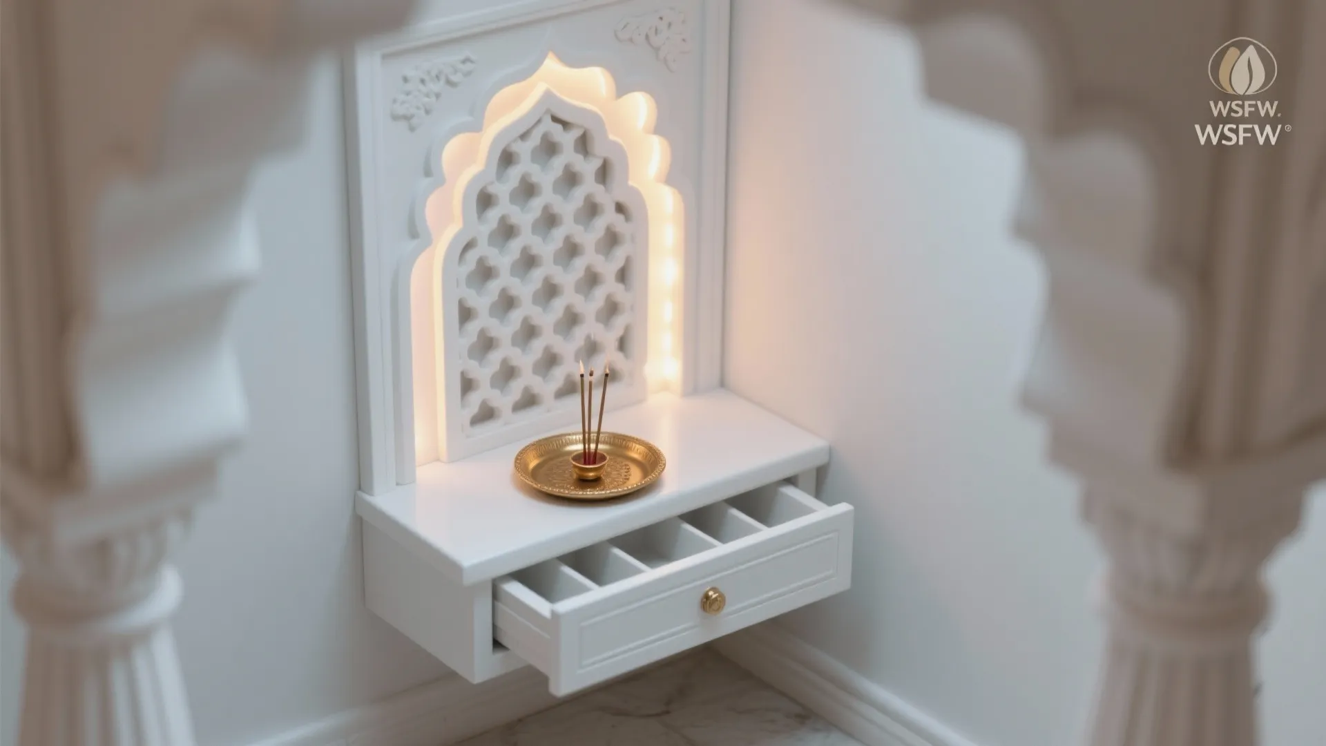 Matte white corner mandir with carved jali and hidden warm LEDs creating a soft halo.