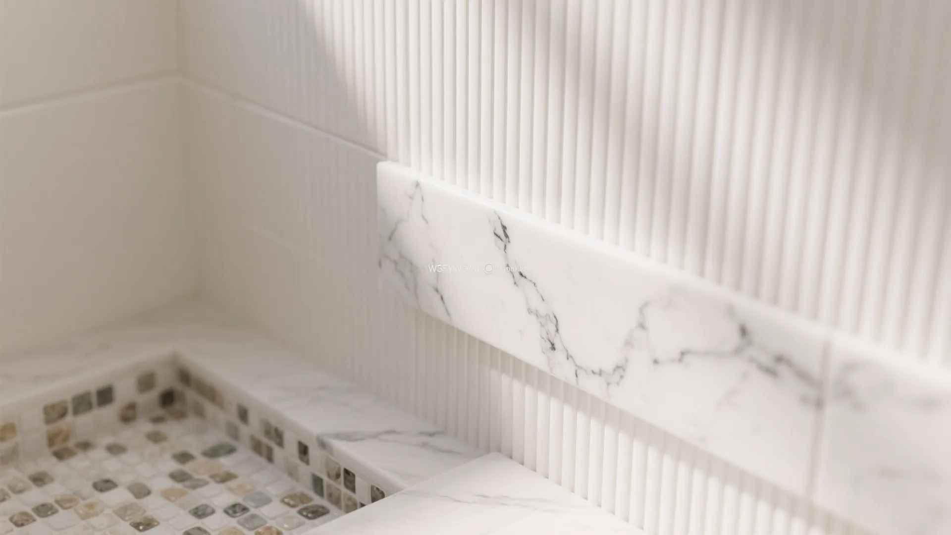 Detailed view of white marble wall panel with vertical lines and small stone floor tile patterns