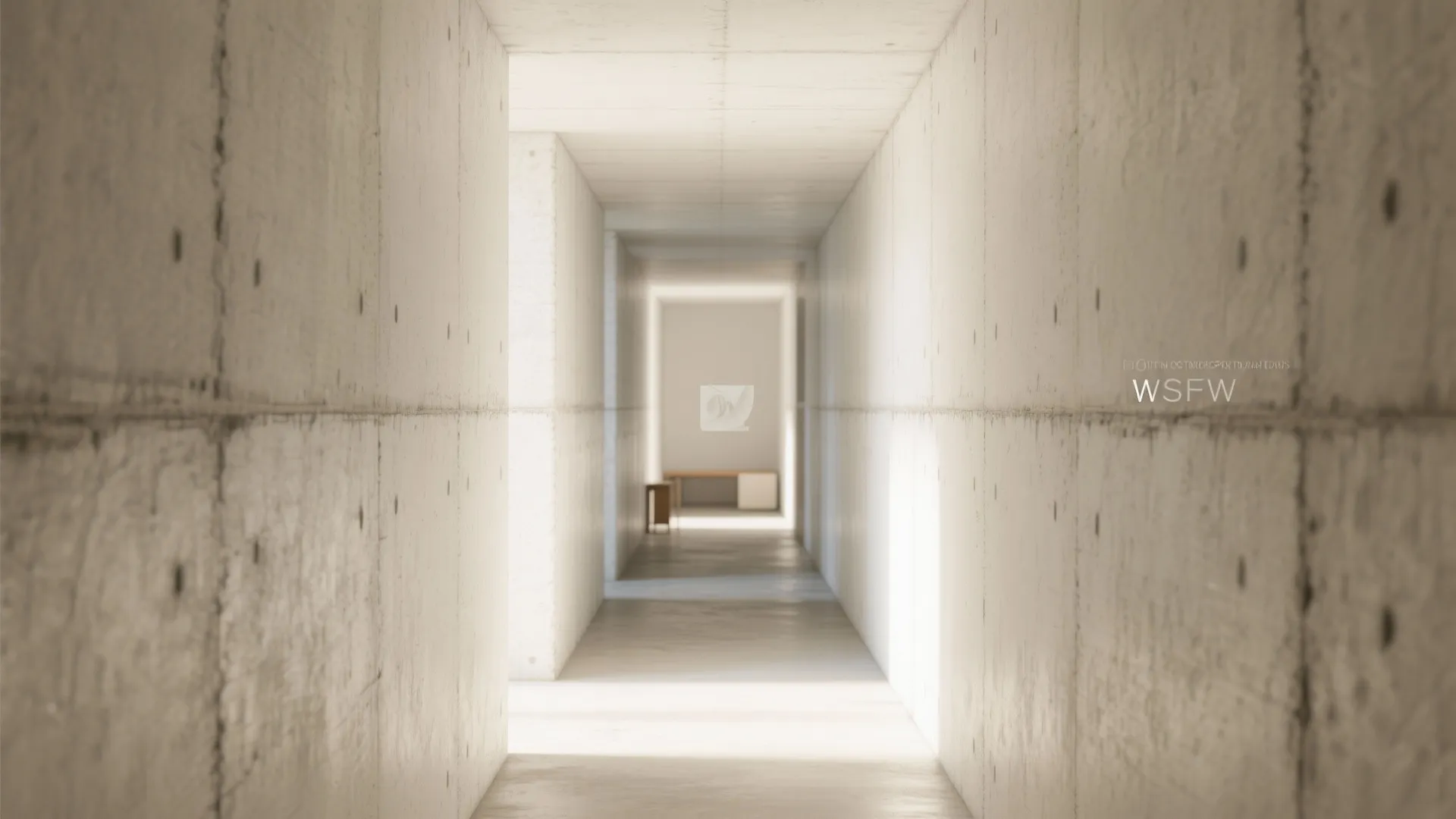 Long narrow hallway with industrial concrete walls and bright natural light coming from the end