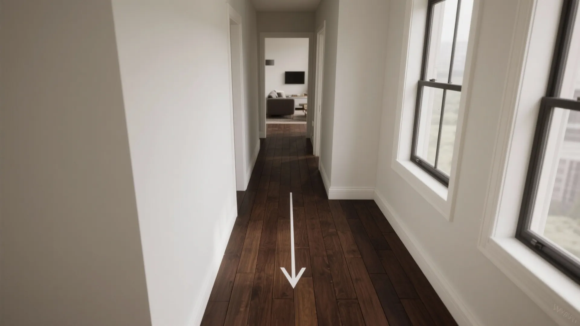 Narrow hallway with dark wide wood flooring white walls side windows and a white direction arrow