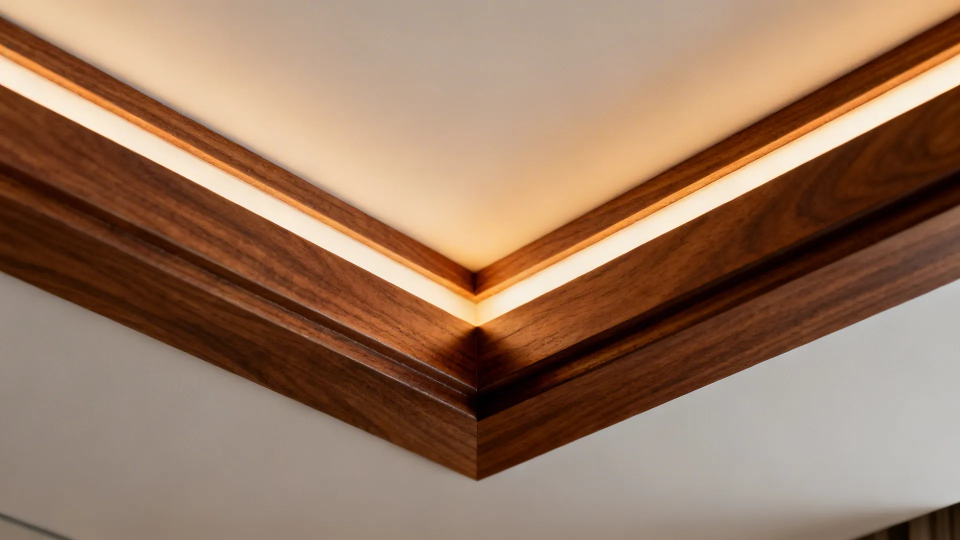 Close up of wooden ceiling trim with built in light strip for warm interior lighting