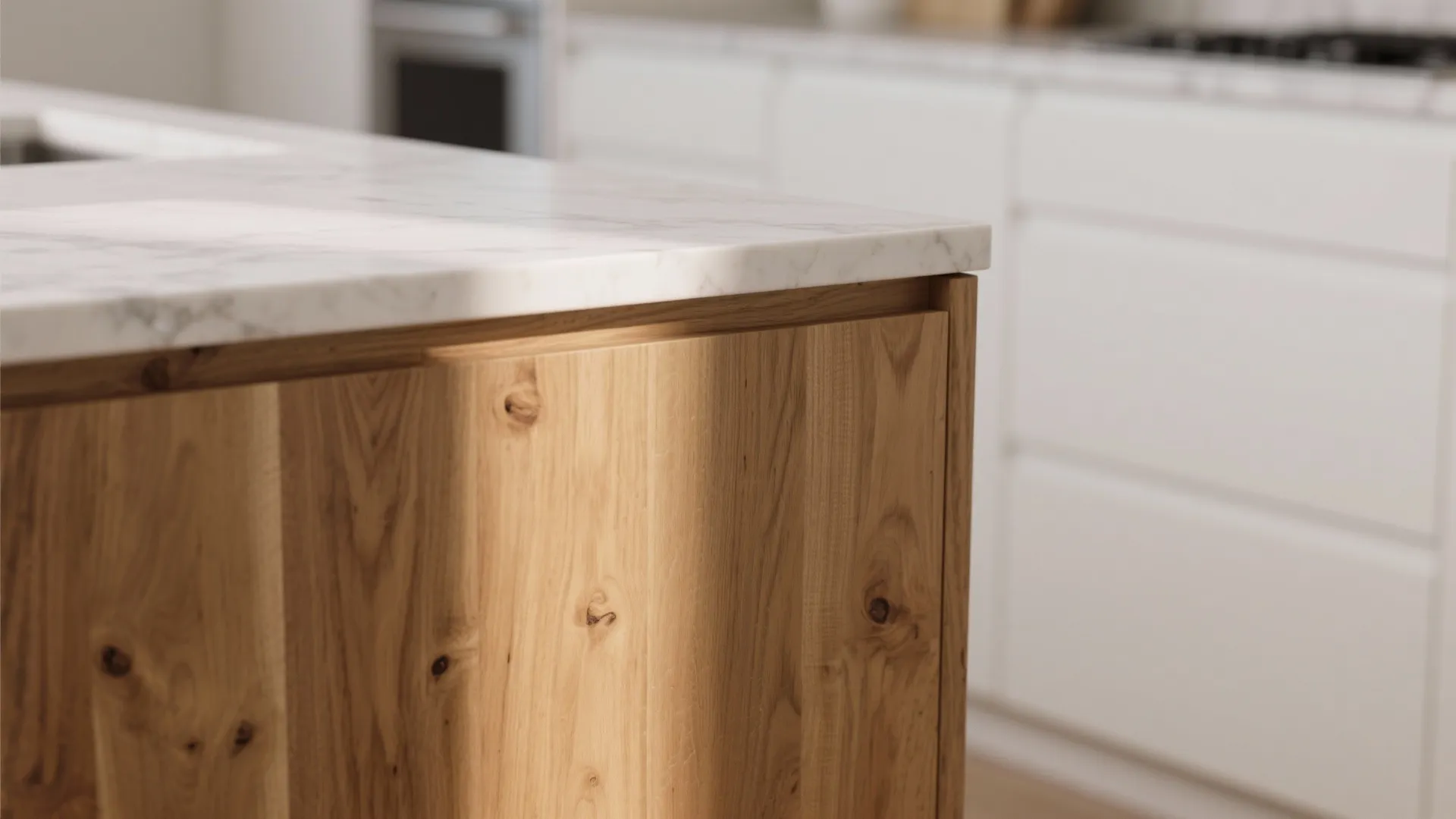 Close up of a wooden kitchen island with marble top showing natural wood texture and grain