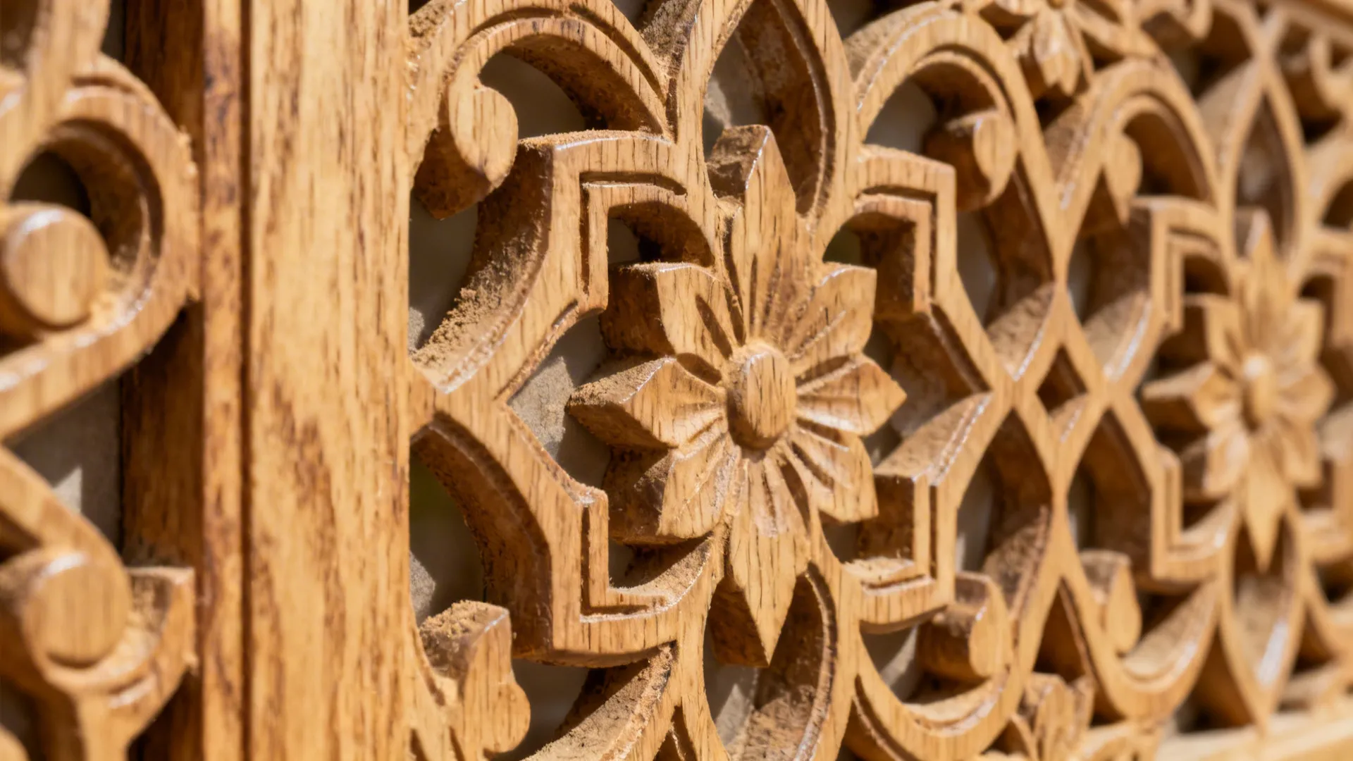 Macro of carved oak jali showing clean edges, fine grain, and low-sheen finish.