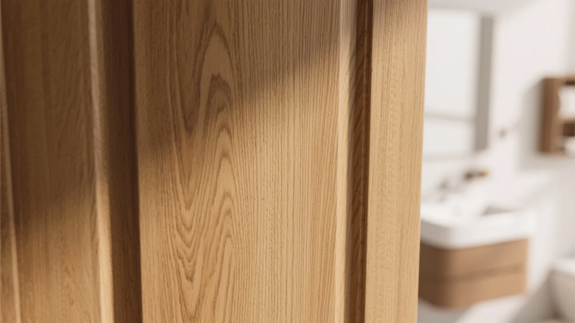 Close up of a light brown wood texture door in a modern and bright bathroom