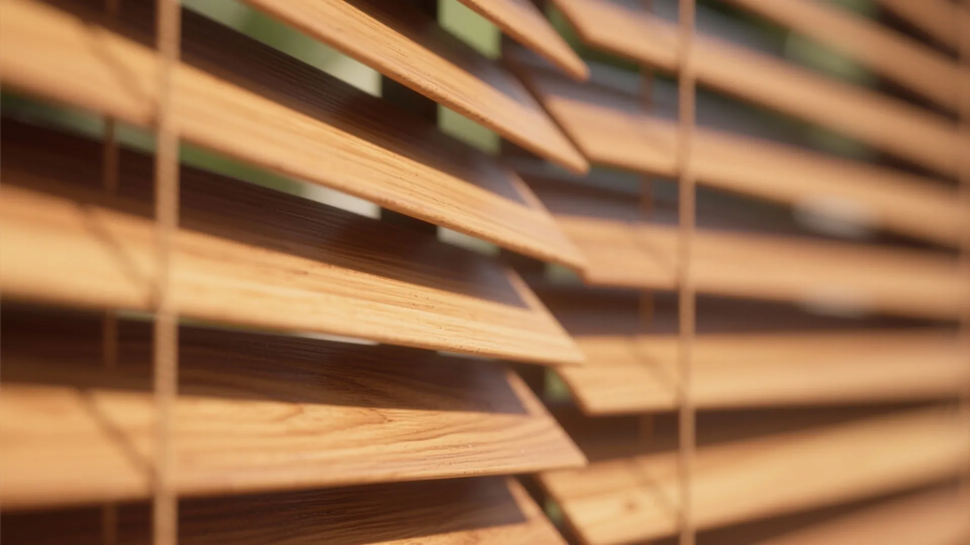 Close up view of horizontal wooden window blinds showing natural texture and warm sunlight highlights