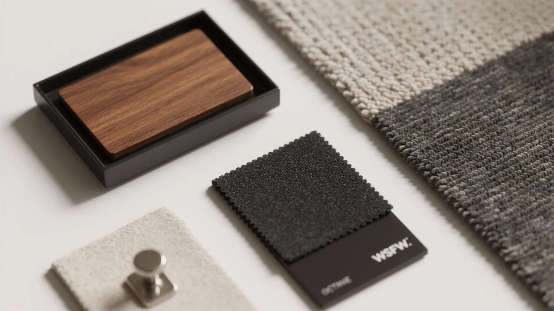 Interior design material board with wood sample black fabric swatch textured carpet and metal door handle