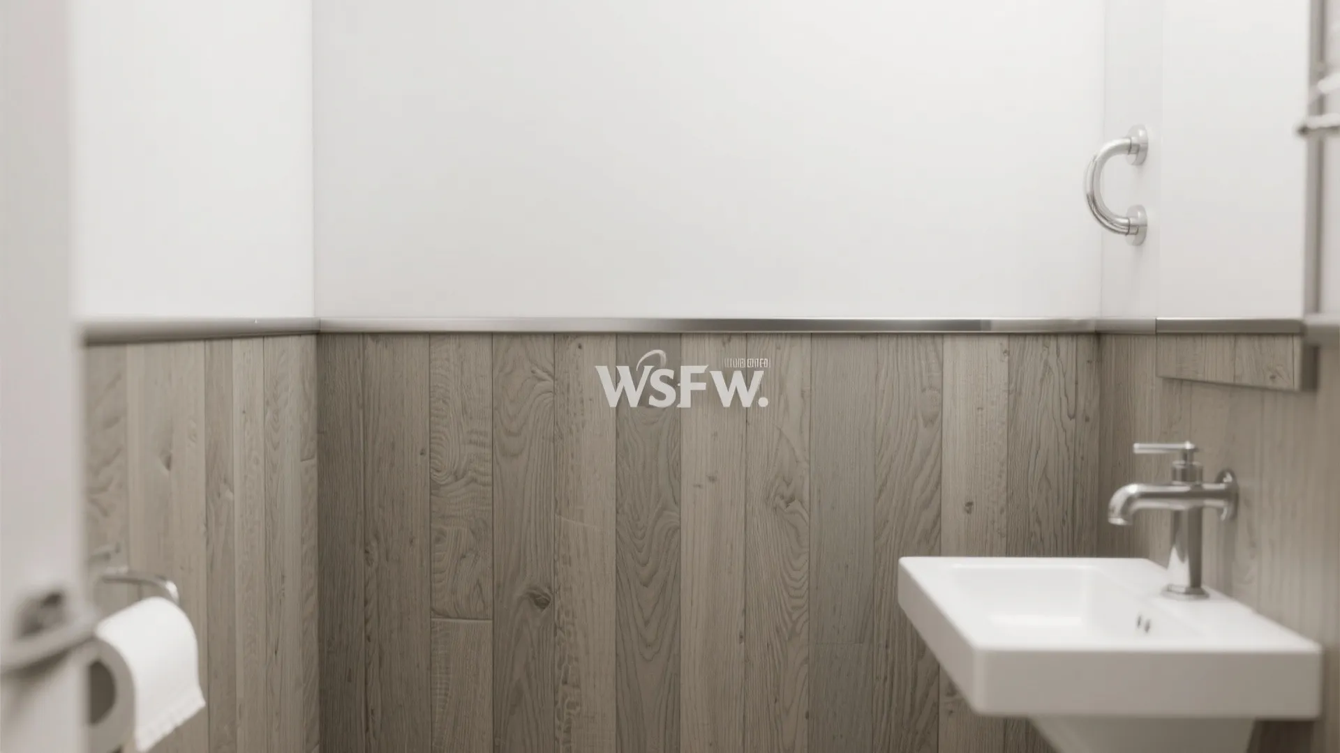 Small bathroom featuring grey wood wall panel design below a white wall and metal sink
