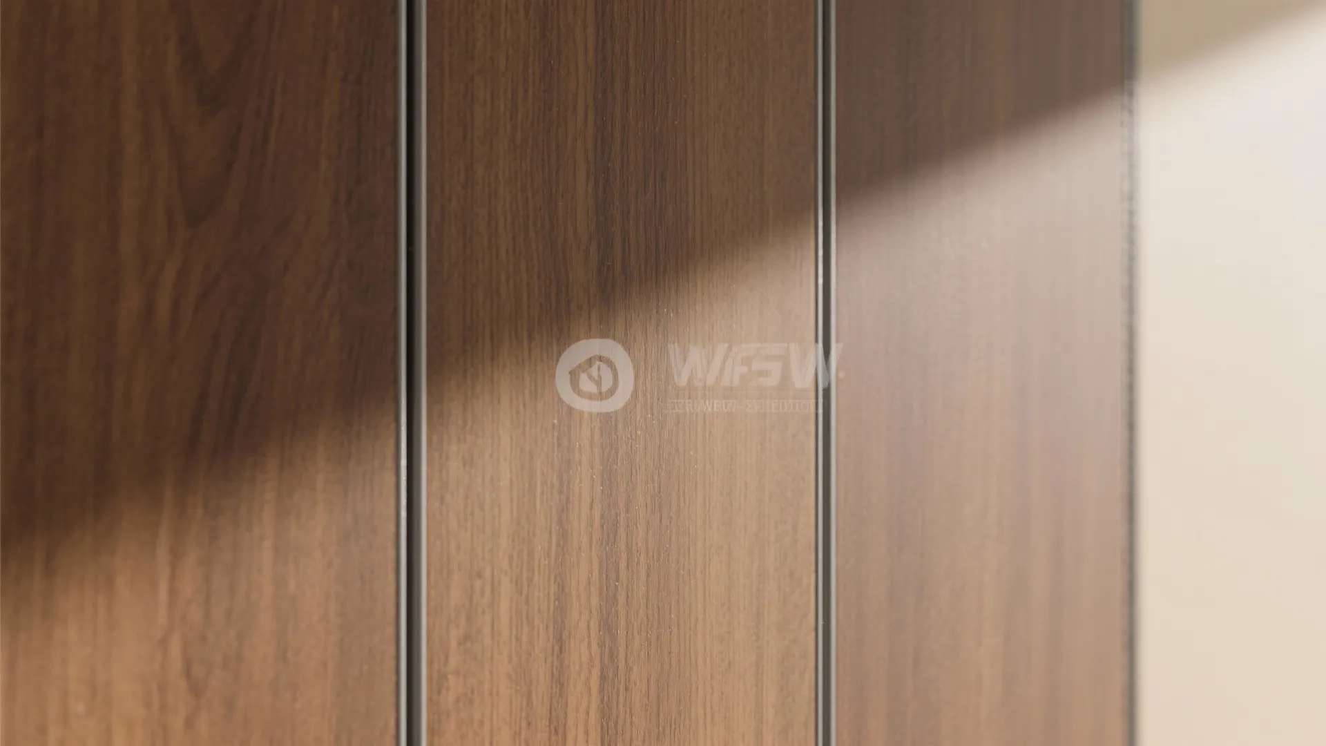 Macro of realistic wood-grain PVC with matte finish and aligned seams for a refined wall panel detail.