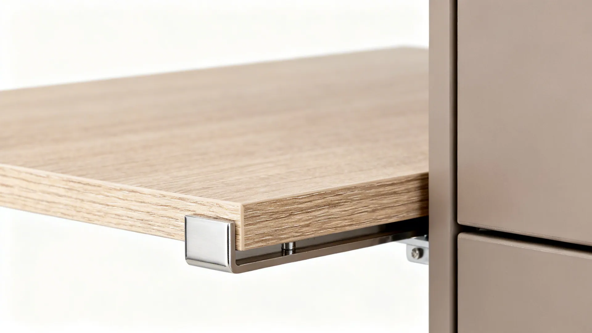 Macro of ash wood-look laminate shelf with brushed nickel support in soft light.