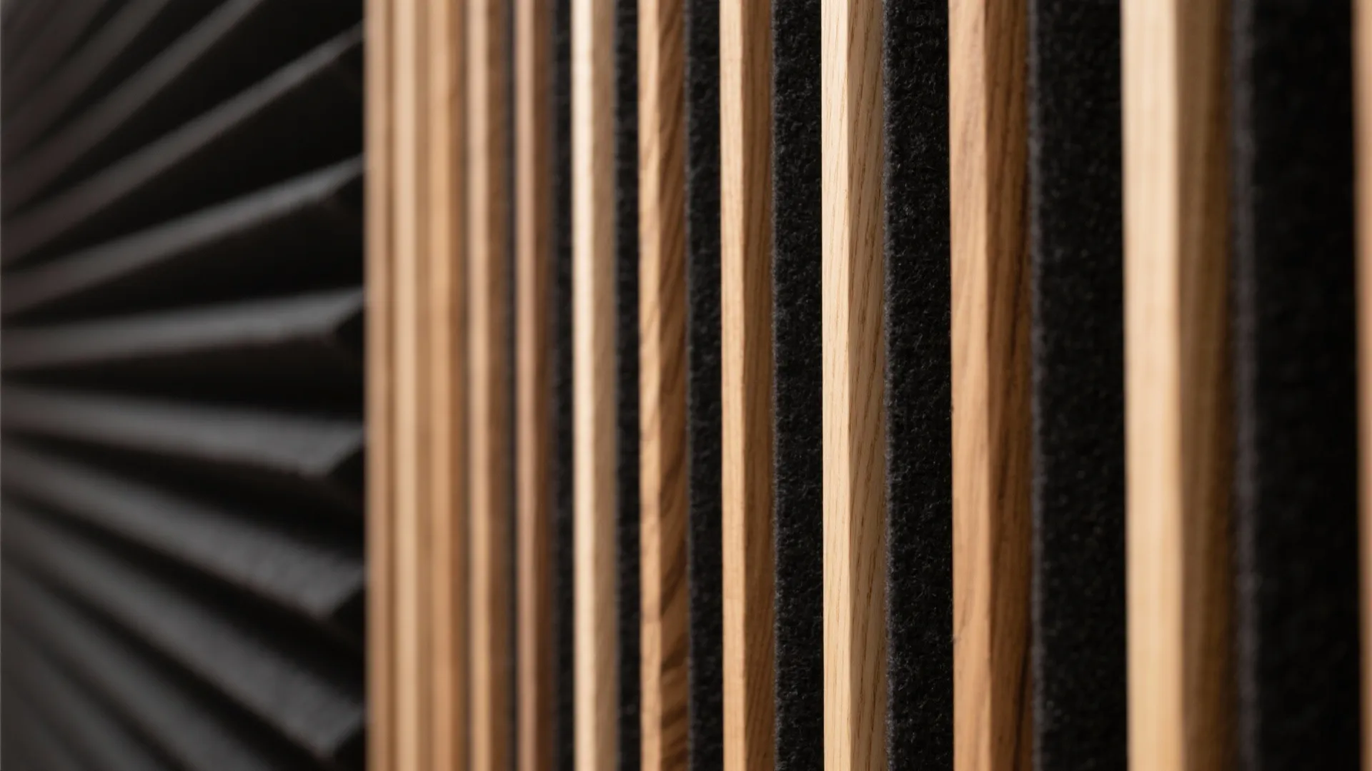 Close up of vertical wooden wall panel pieces with black material gaps for modern design