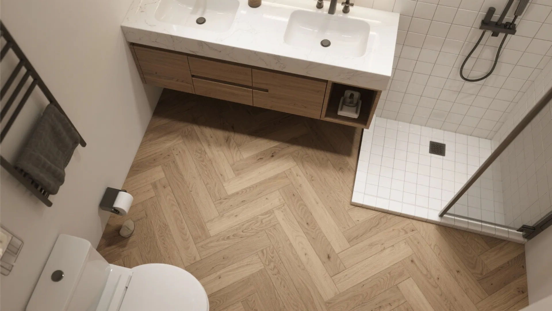 Modern bathroom with wood herringbone floor white double sink cabinet toilet and white tiled shower