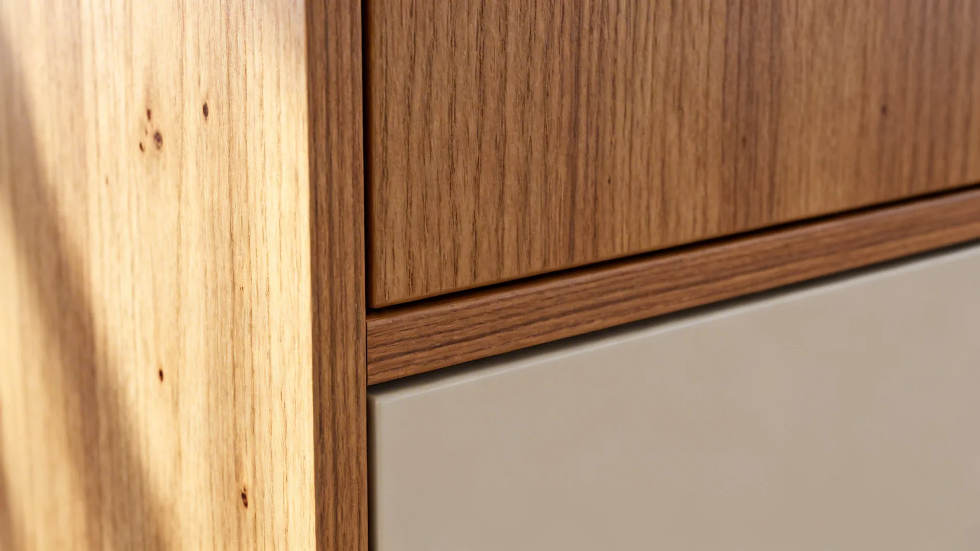 Macro of oak veneer grain and clean edge banding with a matte finish.