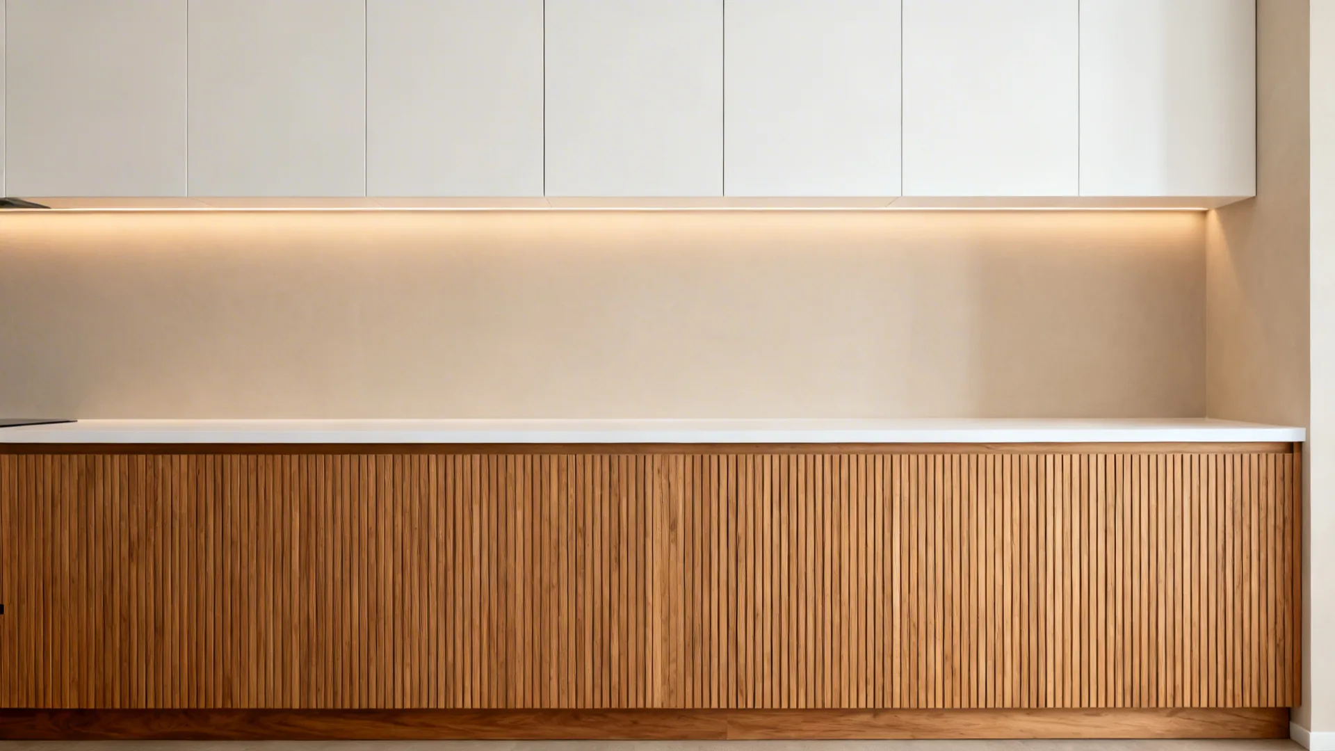 Vertical-grain oak base cabinets paired with white uppers in a bright compact kitchen.