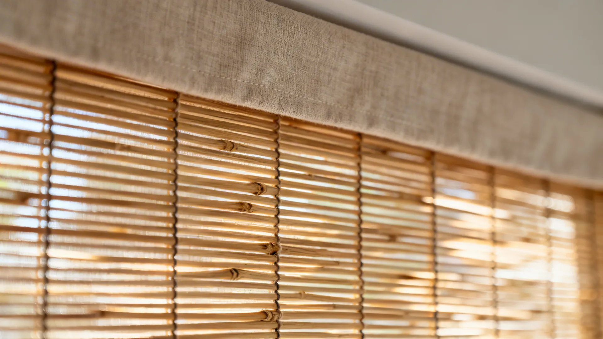 Macro of bamboo woven shade with a soft liner and slim fabric valance.