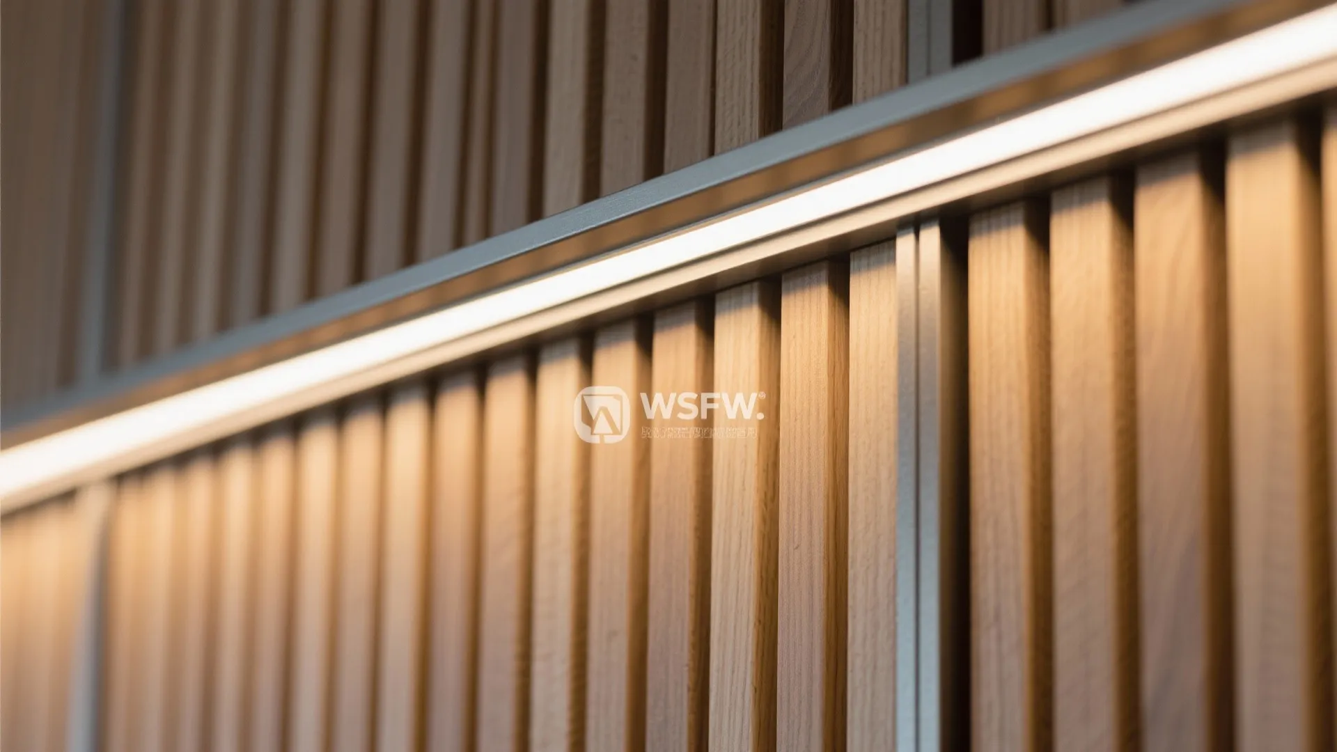 Close up view of warm horizontal light fixture installed on a vertical brown wall panel