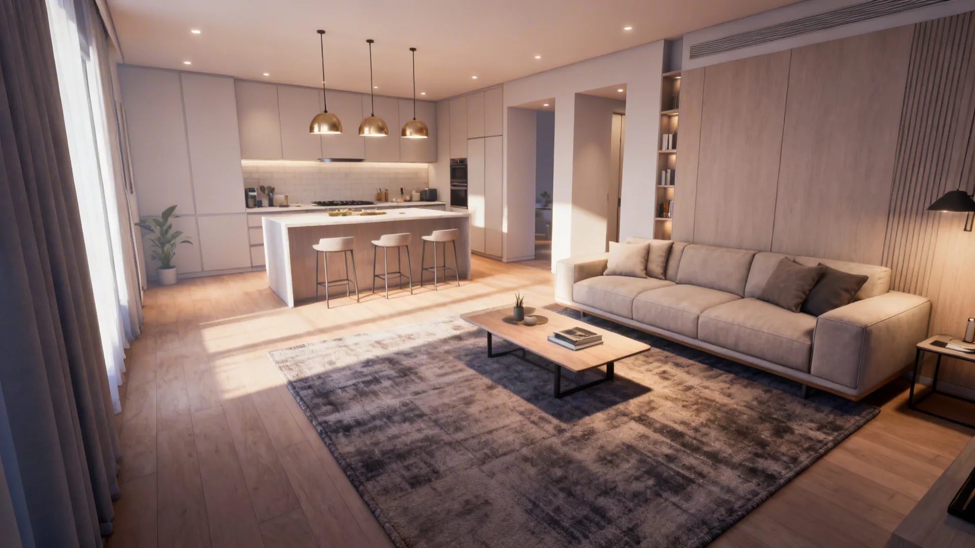 Compact open-plan space with an area rug defining the living area and pendant lights over the kitchen island.