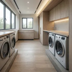 Laundry room with four washing machines on raised platforms under wood cabinets and wood floor
