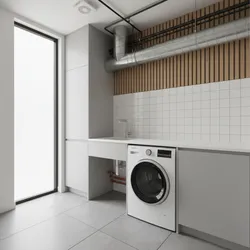 Modern laundry room with white washing machine sink wooden wall panel and exposed industrial pipes