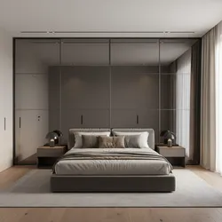 Modern bedroom featuring a large black mirror closet wall with grey bed and bedside tables