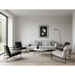 Minimalist living room featuring grey sofa black and white chairs round marble table and rug