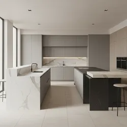 Modern kitchen design with white marble island and black stone island against light grey cabinets