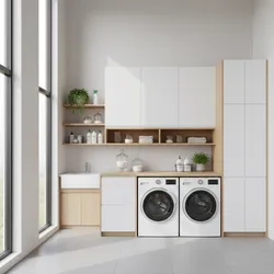 Bright laundry room with high ceiling windows side by side washer dryer sink and cabinets
