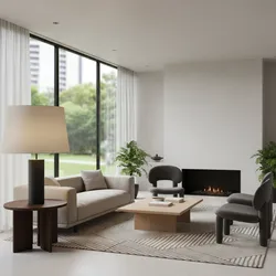 Modern living room with sofa coffee table armchairs rug fireplace large windows and table lamp