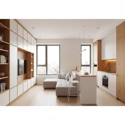 Small open plan apartment with white kitchen cabinets wooden breakfast bar and a grey sofa