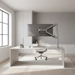 Minimalist home office with a white desk grey chair and monitor attached to silver arm