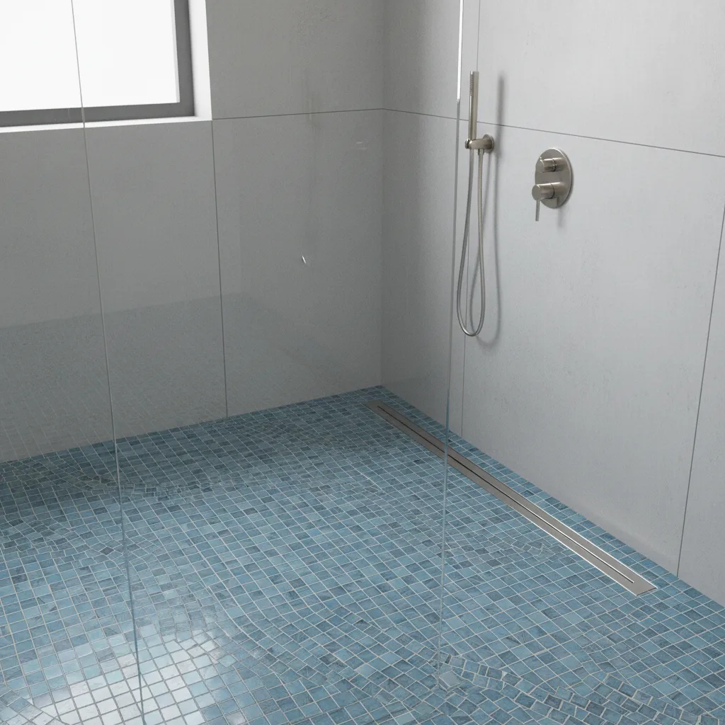 Mosaic tile shower floor sloping toward linear drain for proper water drainage