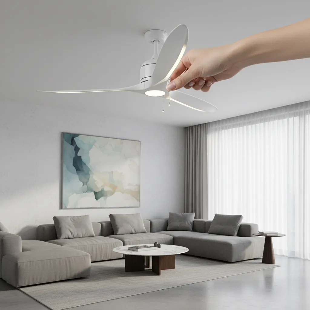 Person manually rotating ceiling fan blades after lubrication