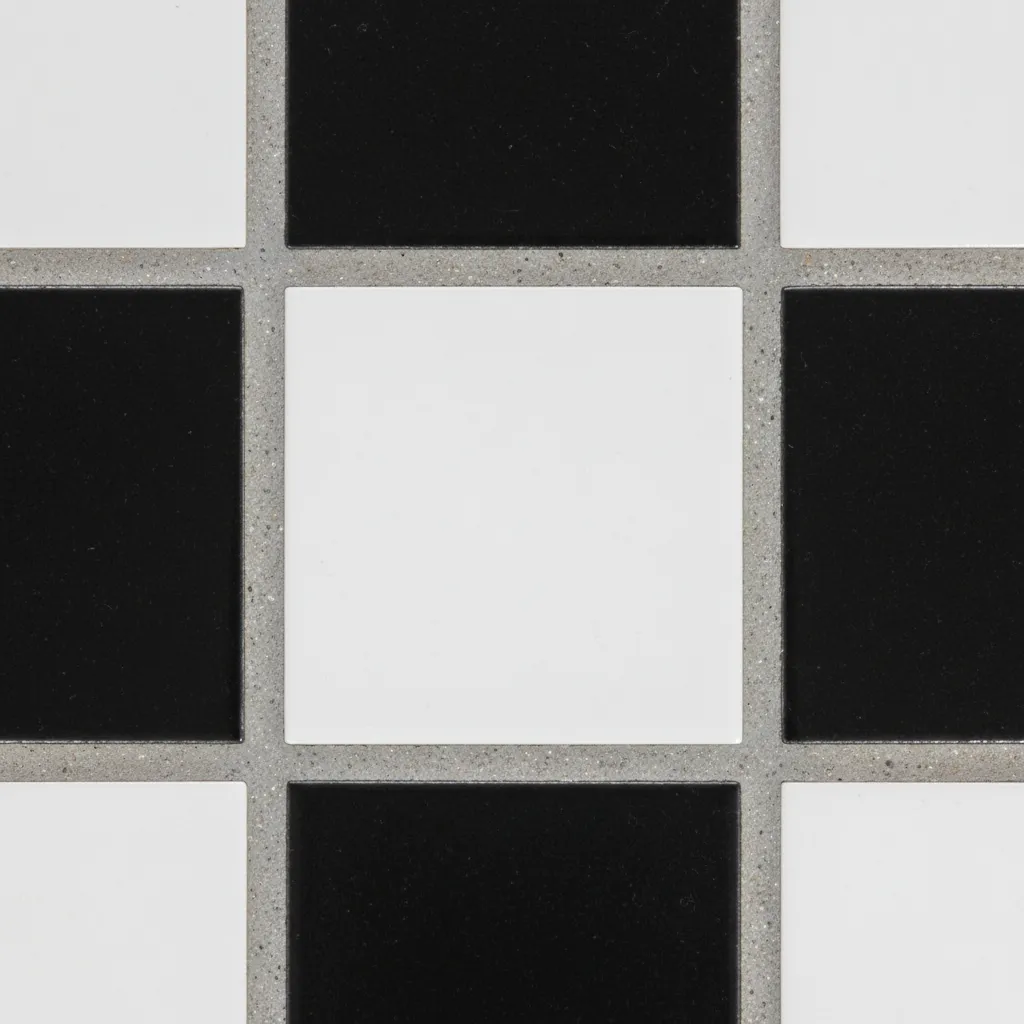 Close up of grout lines between black and white checkerboard floor tiles